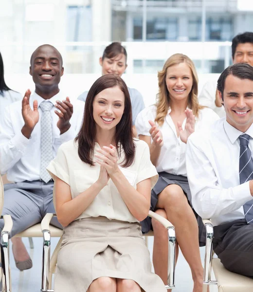 Grupo Colegas Sonrientes Aplaudiendo Alegremente Mientras Ella Sienta Con Los —  Fotos de Stock