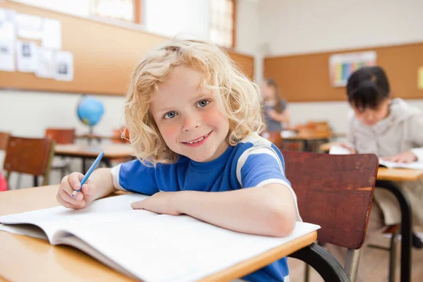Smiling Little Schoolboy Sitting Desk Exercise Book — Stock Photo, Image