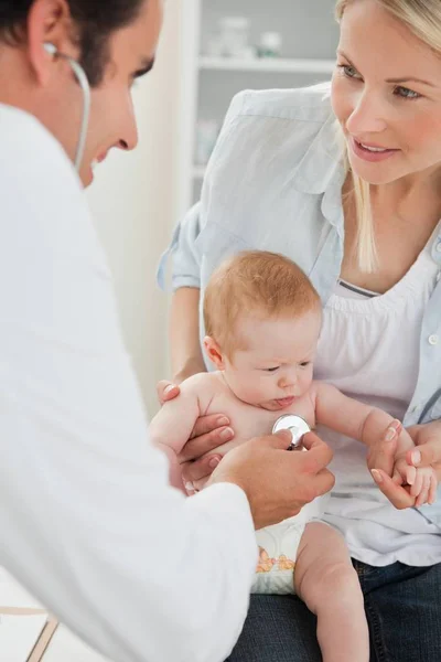 Doctor Taking Babys Heart Beat Stock Picture