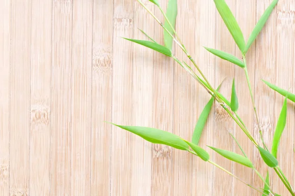 Green Bamboo Leaves Wooden Background — Stock Photo, Image