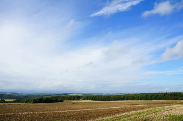 sky over harvested fields