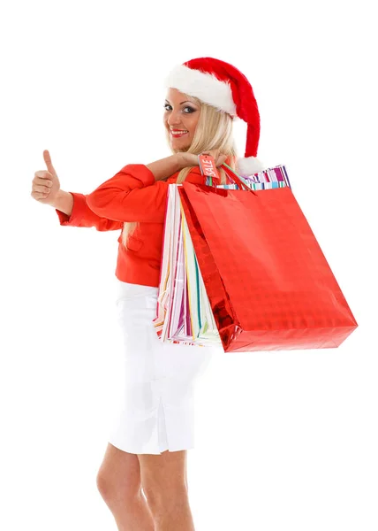 サンタさんの帽子の若い女性が白い背景に立っています クリスマスセール — ストック写真