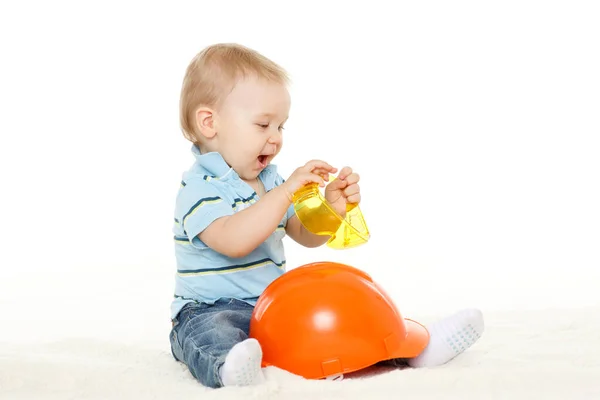 Little Child Plays Orange Construction Protective Helmet Huge Yellow Protective — Stock Photo, Image