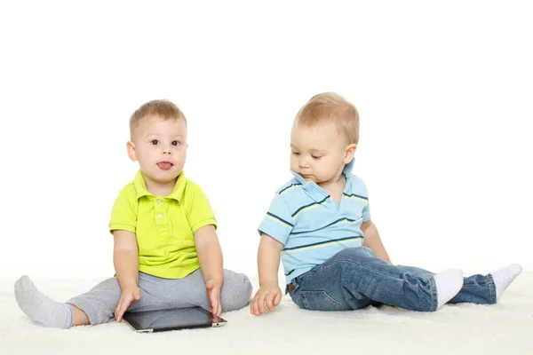 Two Little Boys Computer Tablet Sit Floor White Background Stock Photo