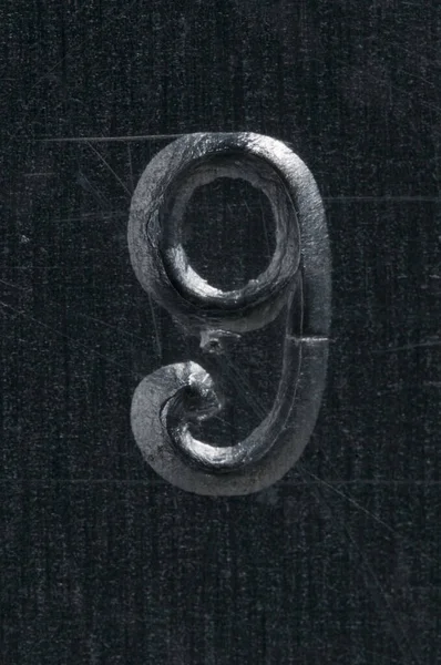 金属番号Xにパンチされたマクロショット — ストック写真