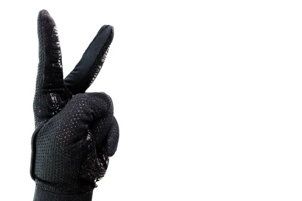 白地に隔離された男の手に黒い手袋の勝利のシンボル — ストック写真