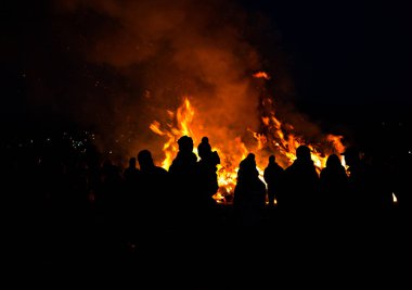 silhouettes of people in frontof big easter fire clipart