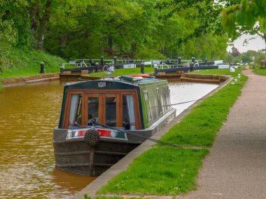 Mooring narrowboat on the Trent and Mersey Canal in front of the Red Bull Lock near Stoke-on-Trent in Staffordshire, England. clipart