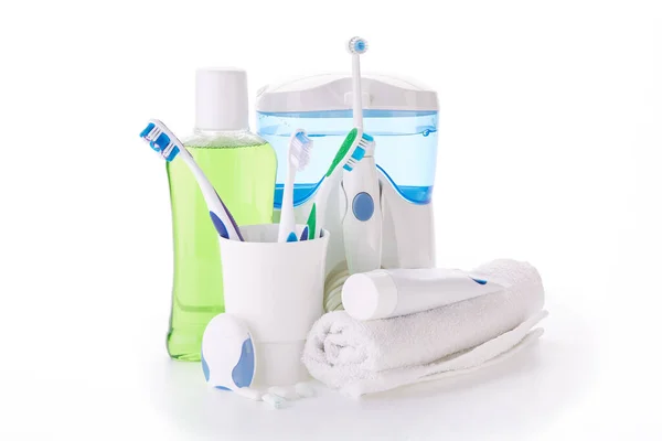 Toothbrushes Toothpaste Oral Irrigator Floss Rinse Gums Fresh Leaves Mint — Stock Photo, Image