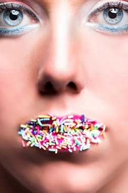 Sugar sprinkles on the lips of a blond woman clipart