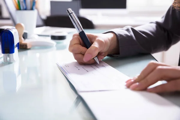 Close Businessperson Hand Signing Cheque Pen Office — Stock Photo, Image
