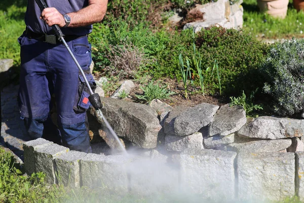 working with the pressure washer