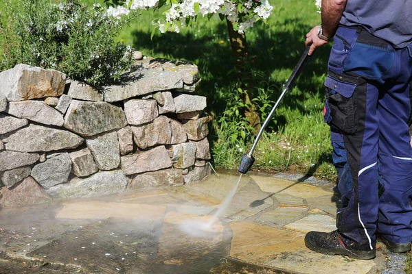 working with the pressure washer