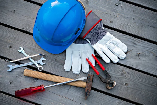 Blue Helmet Different Tools Work Gloves Wooden Ground Royalty Free Stock Photos