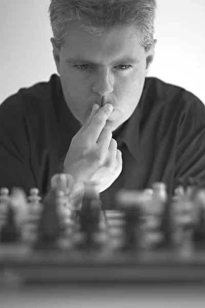 Man playing chess against computer Stock Photo by ©STYLEPICS 11294363