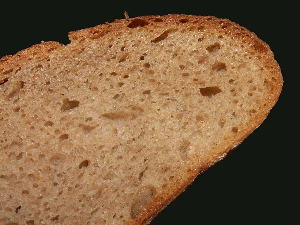 Brot Scheiben Auf Schwarzem Hintergrund — Stockfoto