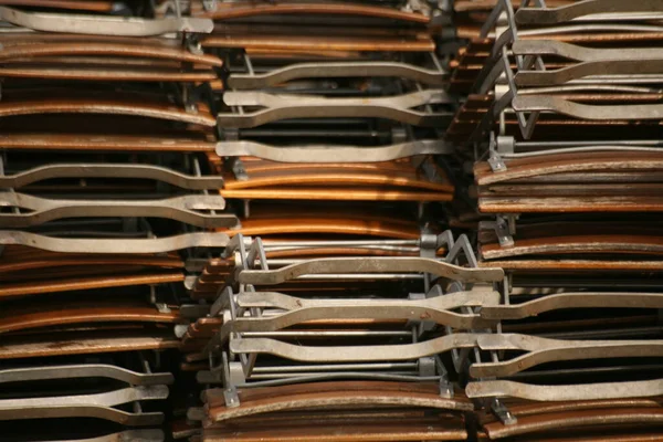 Stock image Stack of folded folding chairs