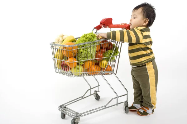 Baby Pushes Shopping Cart — Stock Photo, Image