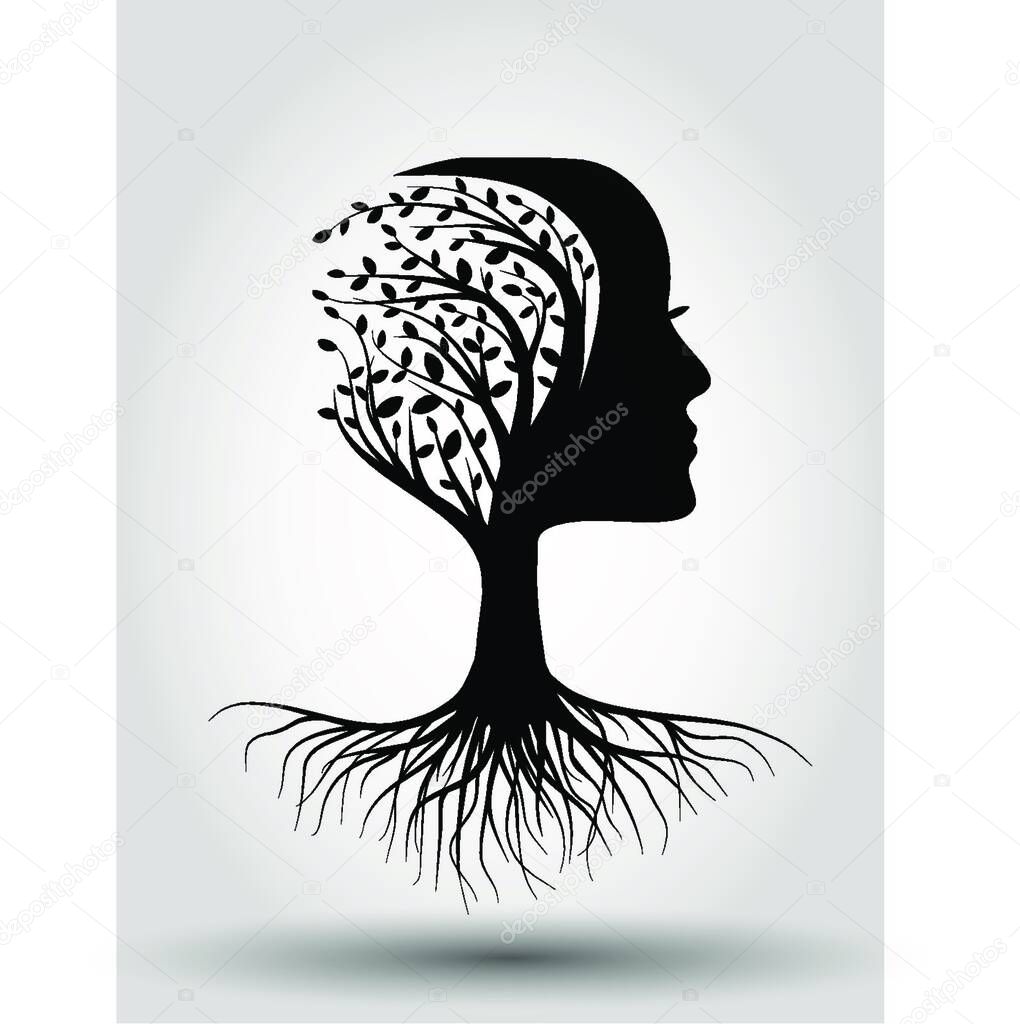 Silhouette of human head with roots and tree