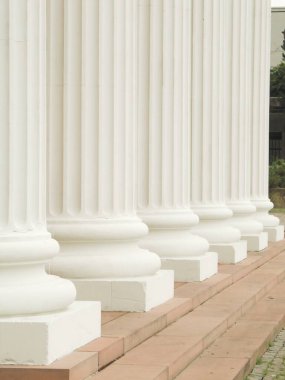 white columns in front of the building clipart