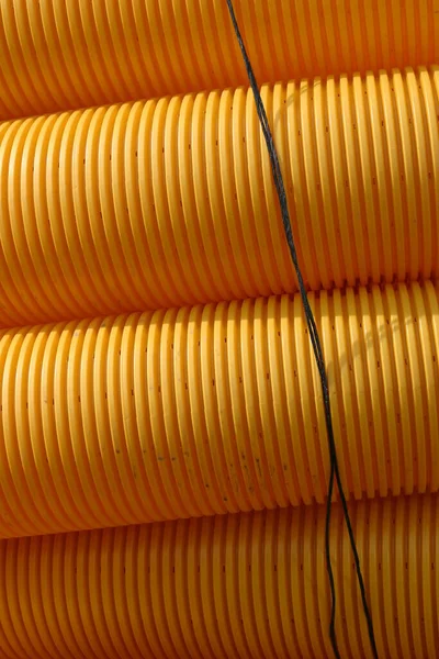 Cierre Una Pila Tubos Plástico Amarillo —  Fotos de Stock