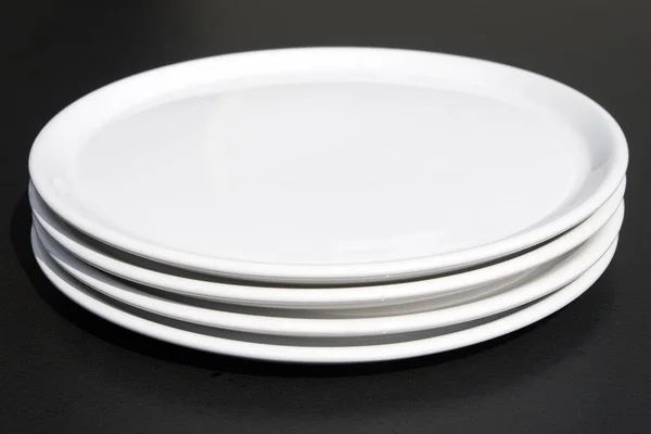 White Plates Black Background Stock Picture