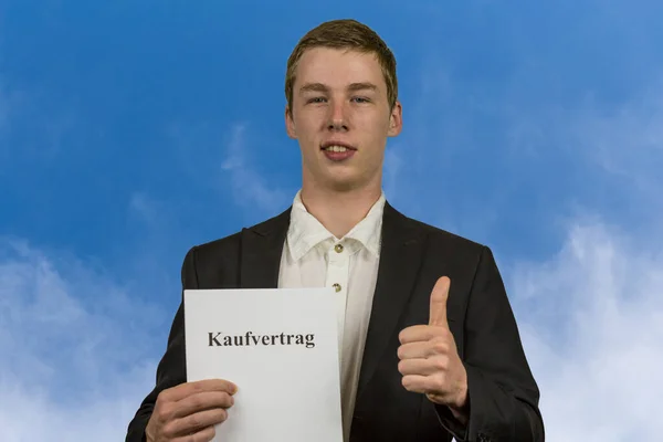 Young Man Holds Purchase Contract His Hands Happy — Stock Photo, Image