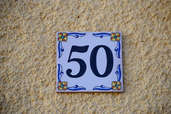 HOUSE FACADES,STREET SIGNS,ENAMEL,TILES,SPAIN,HOUSE NUMBER 50
