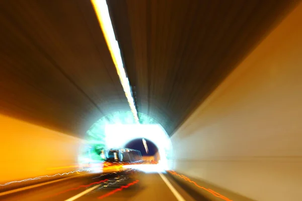 Long-term exposure while driving through a tunnel and bright light at the end of the tunnel