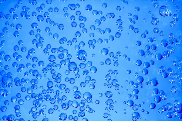 Numerous gas bubbles form in carbonated water.