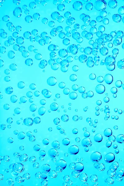 Numerous gas bubbles form in carbonated water.