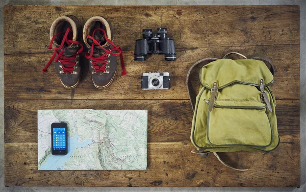 flatlay hiking from above with hiking boots and smartphone