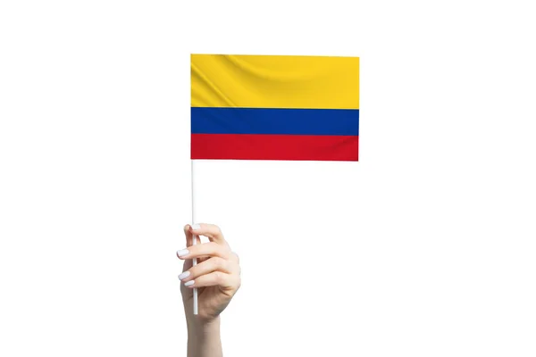 Piękna Ręka Trzymająca Flagę Kolumbii Odizolowana Białym Tle — Zdjęcie stockowe