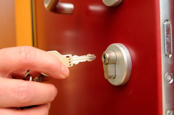locking doors and property as with a key a security measurement against burglary