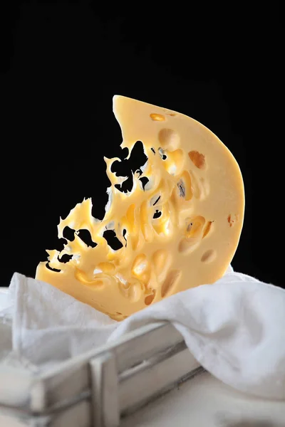 Large Piece Hard Maasdam Cheese Black Background Cheese Lots Holes — Stock Photo, Image