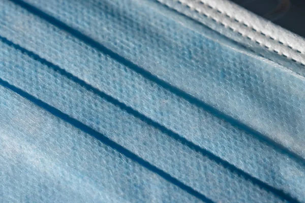 Tekstur Berlesung Pipit Biru Dan Lipatan Topeng Wajah Medis Sekali — Stok Foto