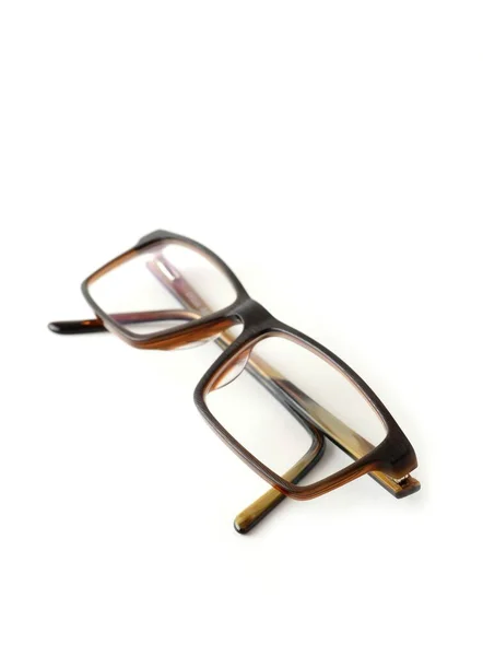 Fechar Óculos Modernos Marrons Dobrados Fundo Branco — Fotografia de Stock