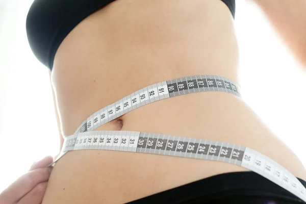 Young Slim Woman Measures Her Hip Circumference Measuring Tape Fitness — Stock Photo, Image