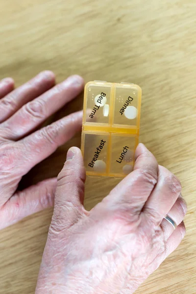 Closeup Elderly Senior Woman Hands Taking Her Medication Week Pill Stock Image