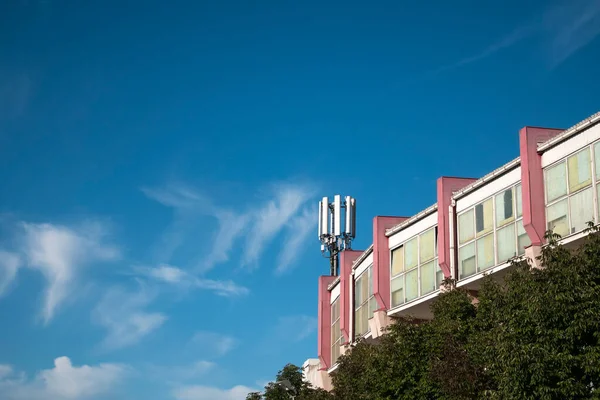 Telecommunication cellular base station on a building, 4G and 5G cellular. Base Station or Base Transceiver Station. Wireless Communication Antenna Transmitter. Telecommunication tower with antennas on a building