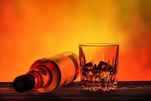 Lying Bottle Glass Whiskey Ice Fiery Background — Stock Photo, Image