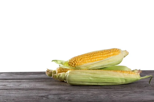 Three Cobs Corn Green Leaves Wooden Table Isolated White Background — Stock Photo, Image