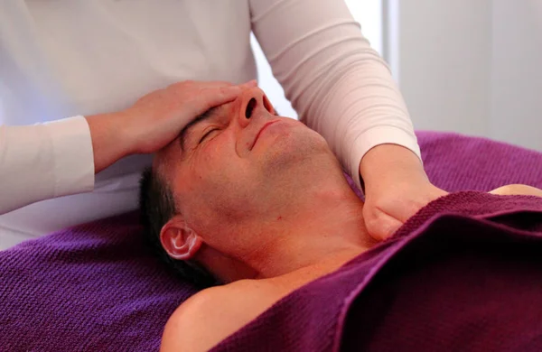Man relaxing by a skin care wellness treatment