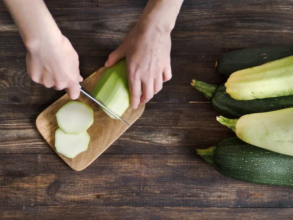Woman Cutting Zucchini Knife Wooden Table — Stock Photo, Image