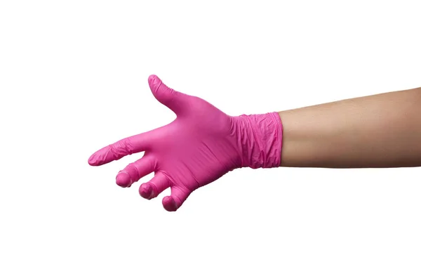 ピンクのラテックス手袋の女性の手は白い背景に隔離され 体の一部は条件付きでウイルスから体を保護し 医学の概念を保持しています — ストック写真