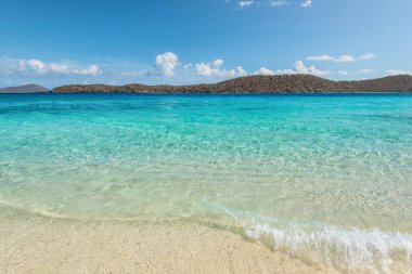 Coki Point Beach and Thatch Cay island in the background in St Thomas, USVI, Caribbean. Summer Vacation Travel Concept. clipart
