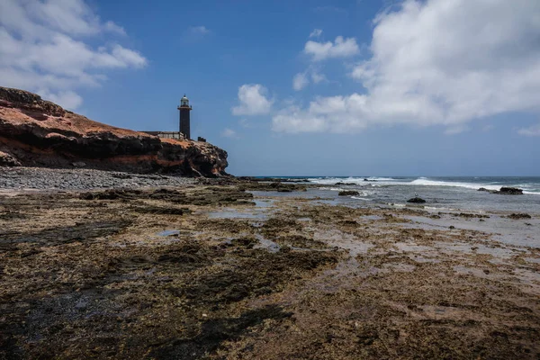 Costa Atlântica Rochosa Maré Baixa Fundo Farol Punta Jandia Fuerteventura — Fotografia de Stock