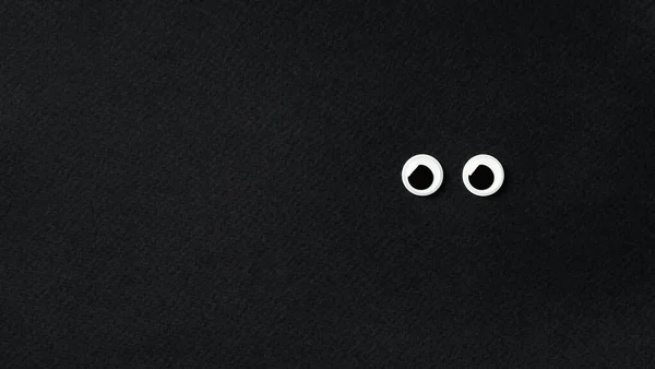 Googly Eyes Black Background Copy Space Left Top View Flat — Stock Photo, Image