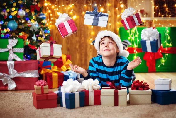 Boy Lying Floor Presents Christmas Tree Child Red Hat Home Stock Image