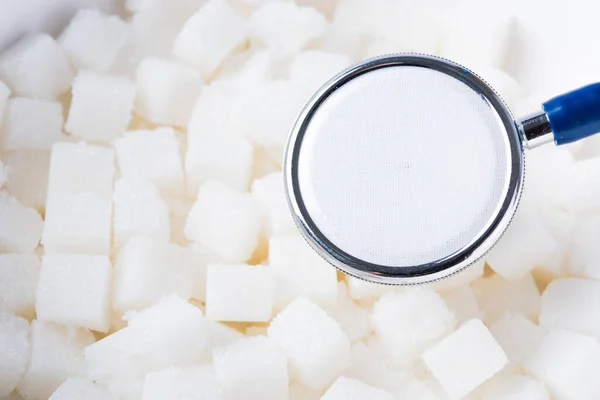 Cubo Açúcar Doce Ingrediente Alimentar Textura Fundo Estetoscópio Médico Estúdio — Fotografia de Stock